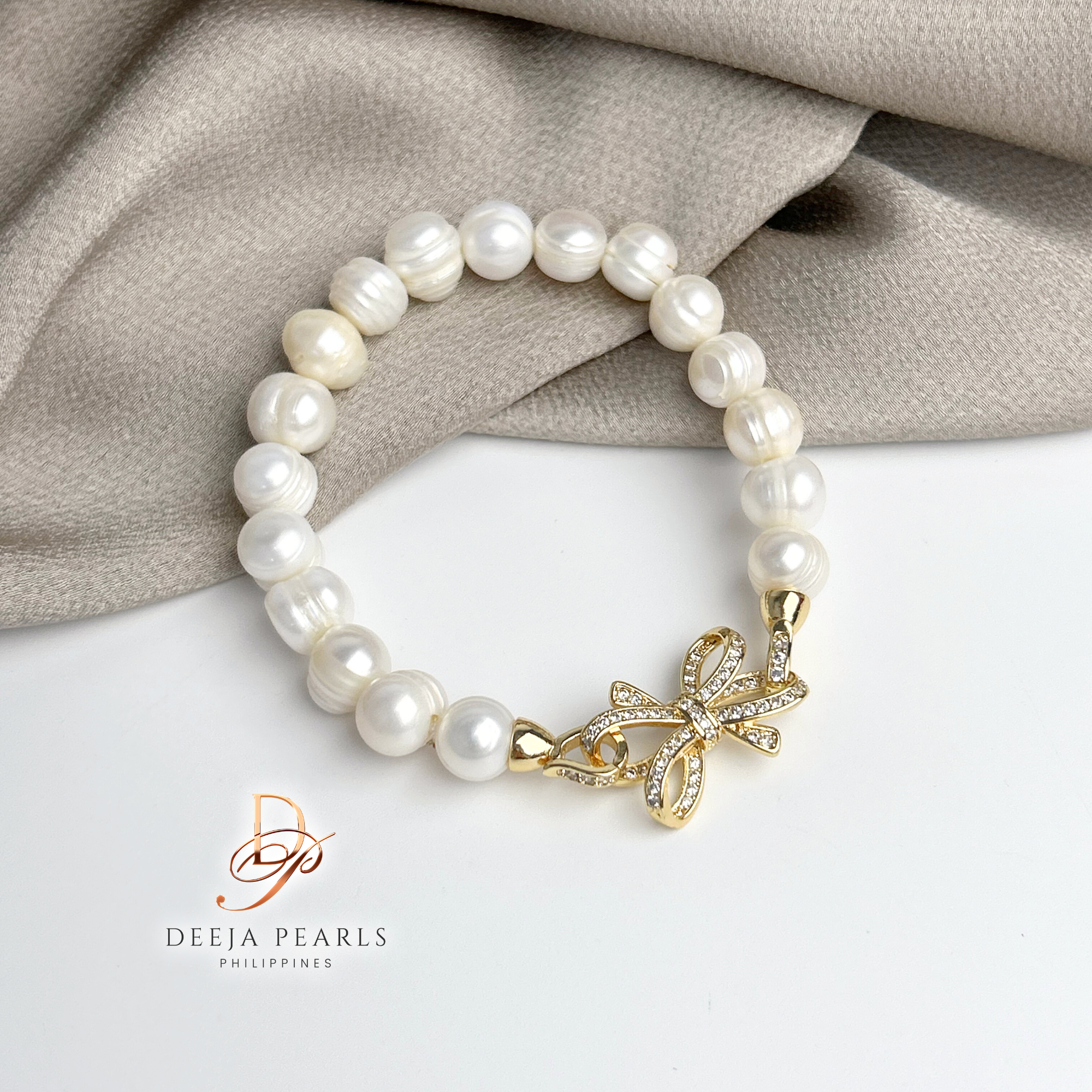DPB113 • Freshwater Pearl Bracelet in Ribbon Pendant Lock