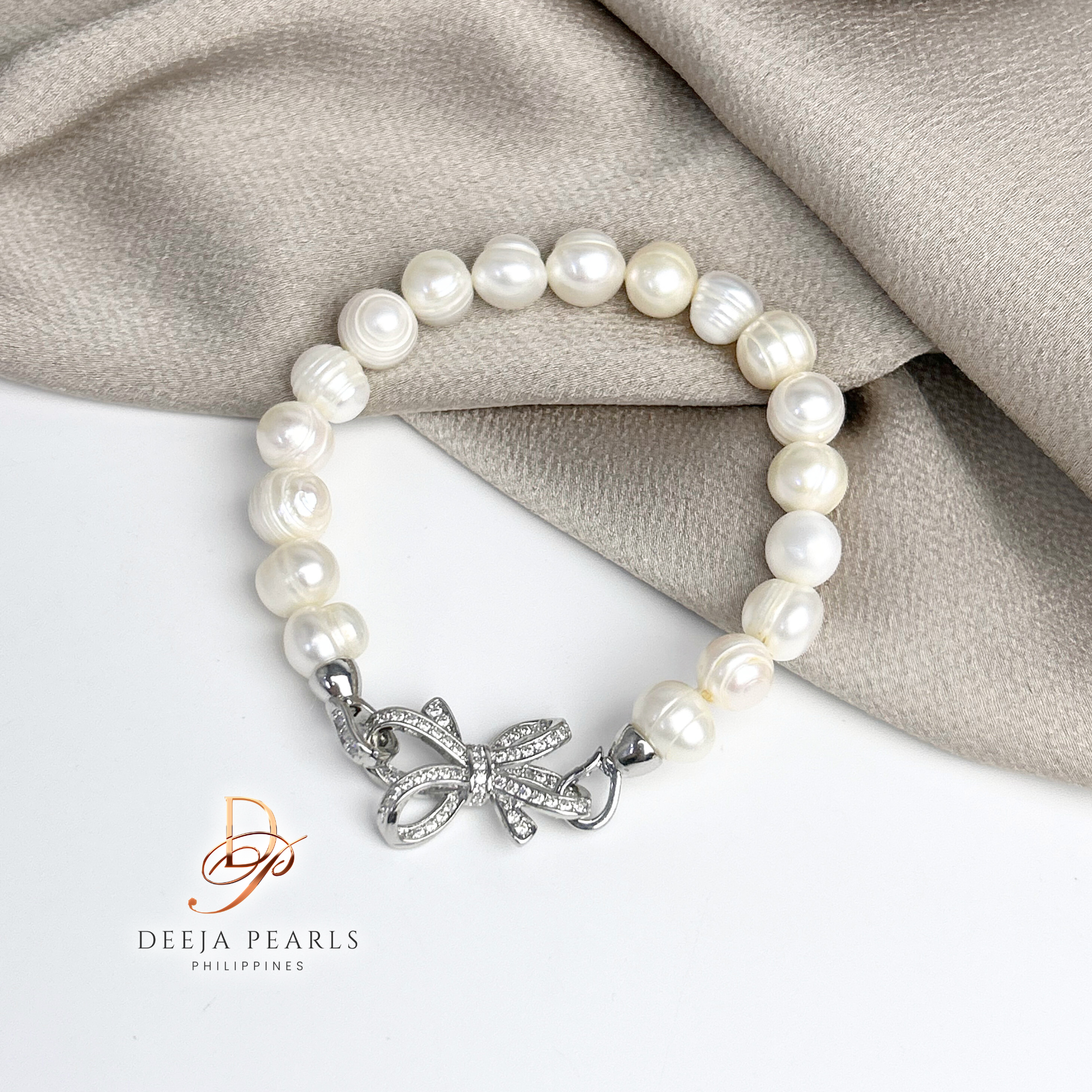 DPB113 • Freshwater Pearl Bracelet in Ribbon Pendant Lock